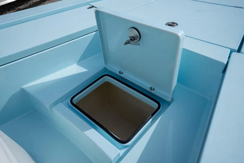 Slide: The Image of Open storage compartment on 2025 Pathfinder 2300 HPS boat, showcasing interior design. - 16
