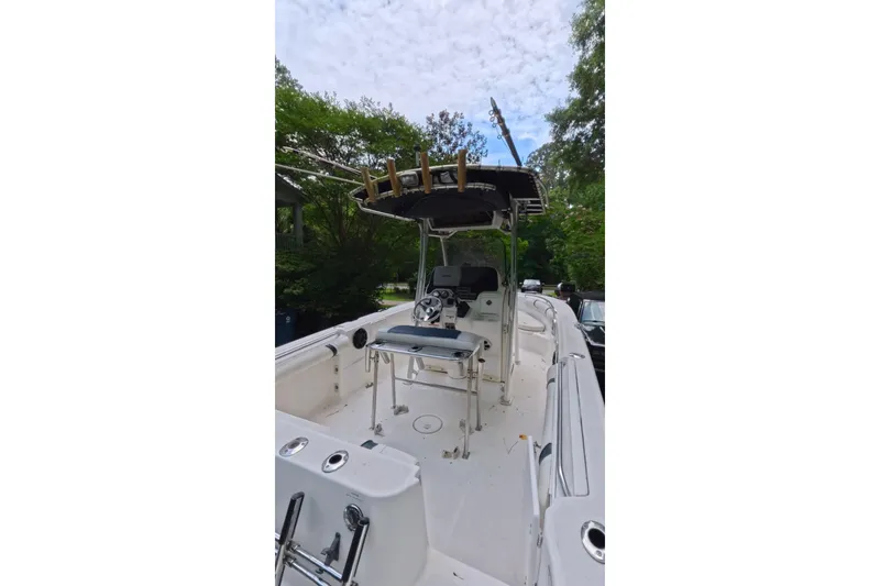 Slide: The Image of 2005 Wellcraft 232 Fisherman boat with center console and rod holders. - 6