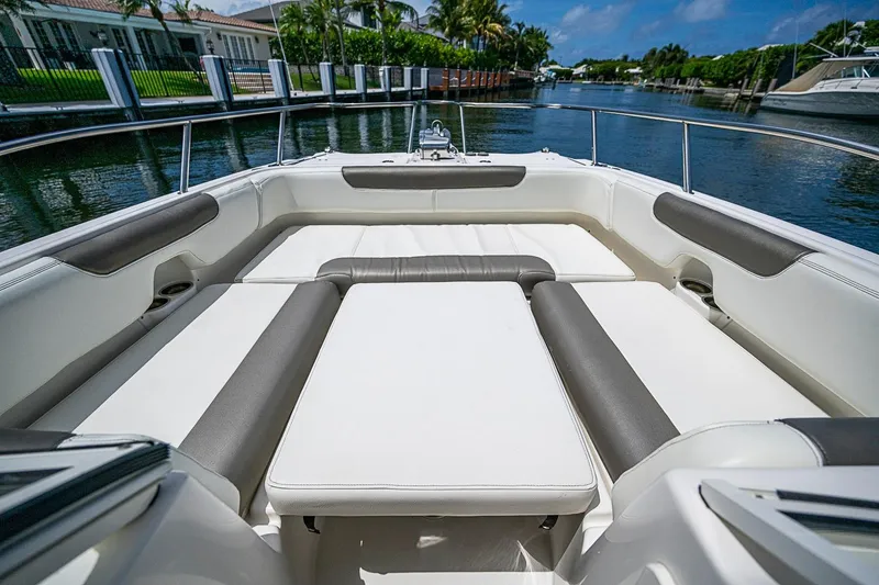 Slide: The Image of Luxurious seating area on a 2020 WorldCat 255 DC boat, docked by a scenic canal. - 14