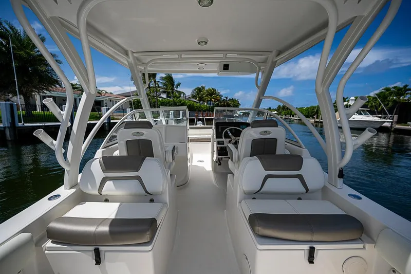 Slide: The Image of Luxury WorldCat 255 DC boat interior with plush seating, 2020 model, docked by waterfront. - 15