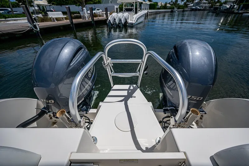 Slide: The Image of Rear view of a 2020 WorldCat 255 DC boat with dual Yamaha 150 engines. - 19