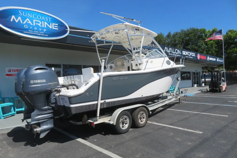 Slide: The Image of 2017 Sea Fox 256 Voyager boat on trailer at Suncoast Marine Group dealership. - 11