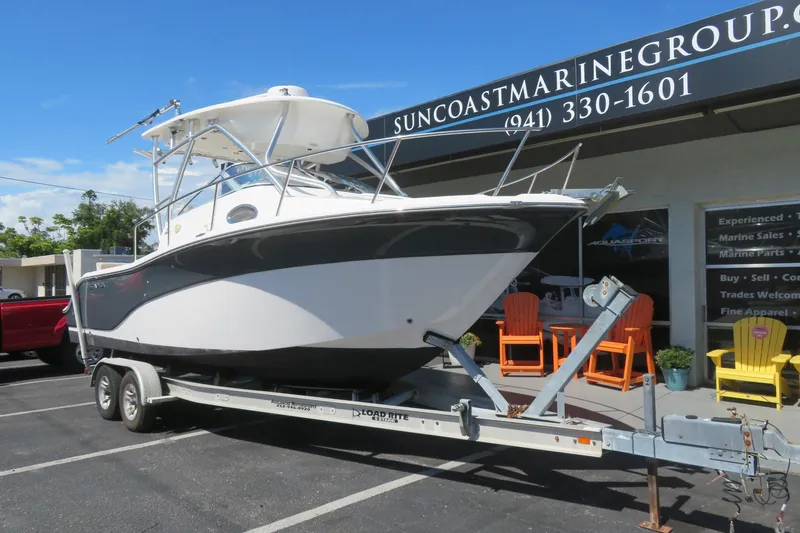 Slide: The Image of 2017 Sea Fox 256 Voyager boat on trailer at Suncoast Marine Group dealership. - 12