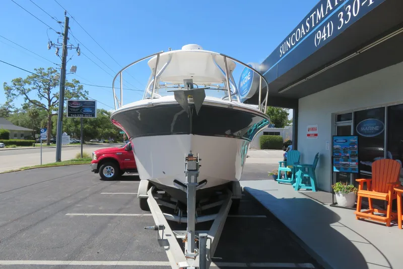 Slide: The Image of 2017 Sea Fox 256 Voyager boat on trailer outside Suncoast Marine dealership. - 13