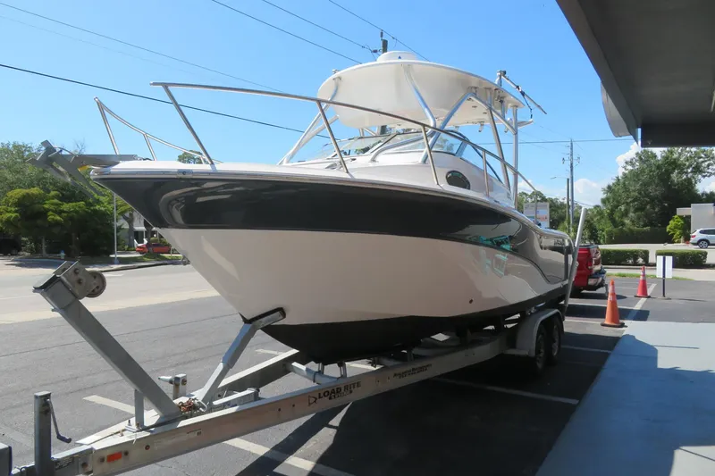 Slide: The Image of 2017 Sea Fox 256 Voyager boat on trailer in parking lot, side view. - 14