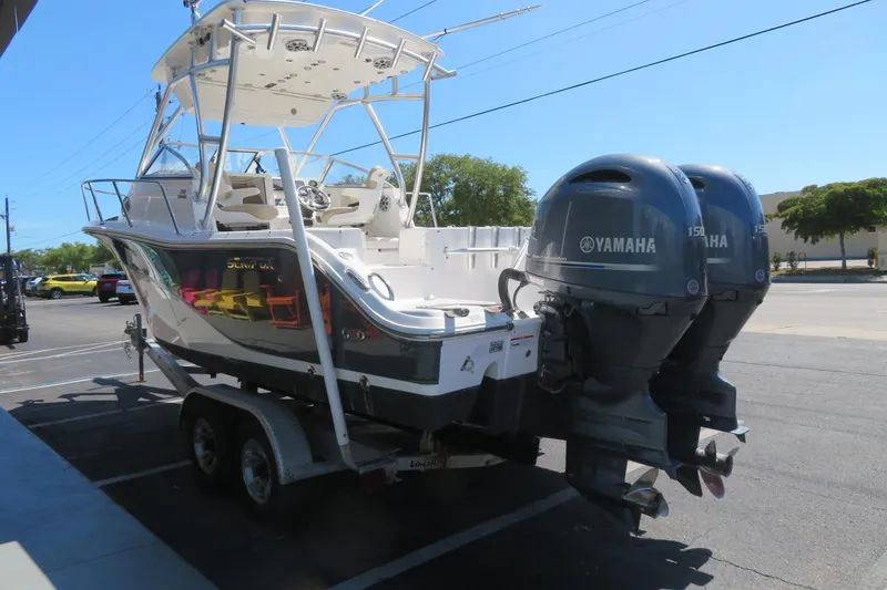 Slide: The Image of 2017 Sea Fox 256 Voyager boat with dual Yamaha engines on a trailer. - 15