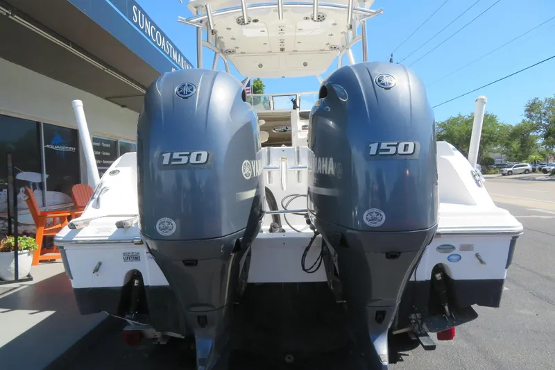 Slide: The Image of 2017 Sea Fox 256 Voyager with dual Yamaha 150 engines at a marina. - 16