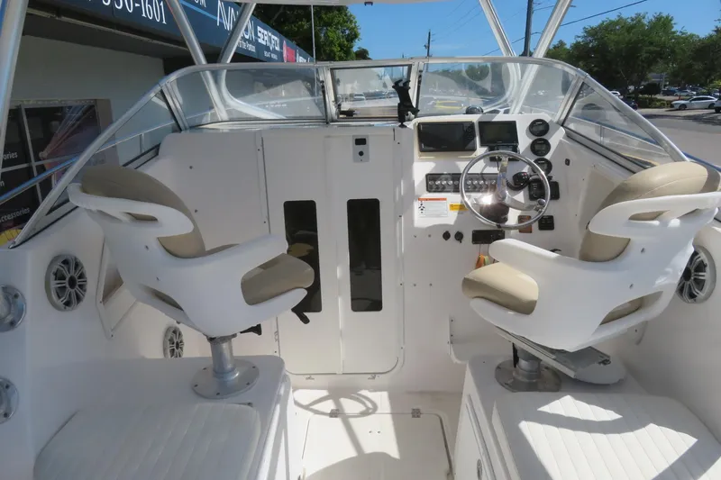 Slide: The Image of 2017 Sea Fox 256 Voyager boat cockpit with dual seats and modern controls. - 19