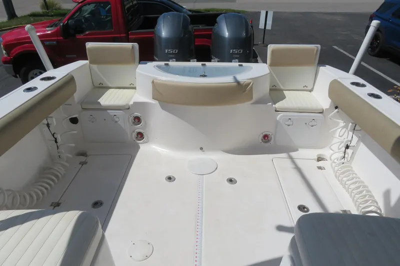 Slide: The Image of 2017 Sea Fox 256 Voyager boat interior with seating and twin 150 engines. - 20