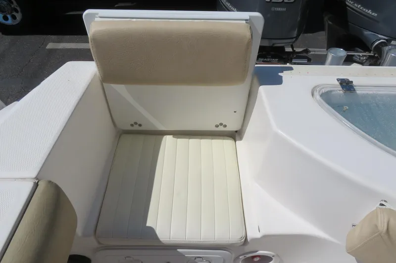 Slide: The Image of 2017 Sea Fox 256 Voyager boat seat with beige upholstery and storage compartment. - 21
