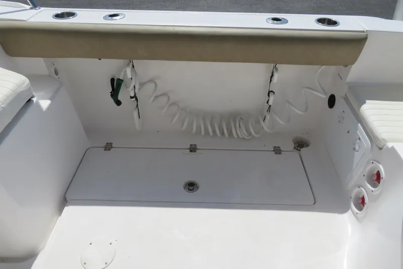Slide: The Image of 2017 Sea Fox 256 Voyager boat interior with seating and storage area. - 24