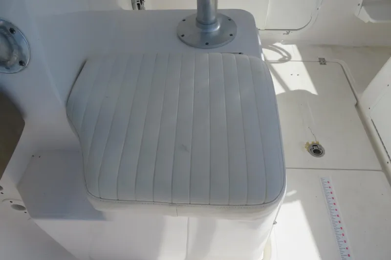 Slide: The Image of White cushioned seat on 2017 Sea Fox 256 Voyager boat deck. - 26