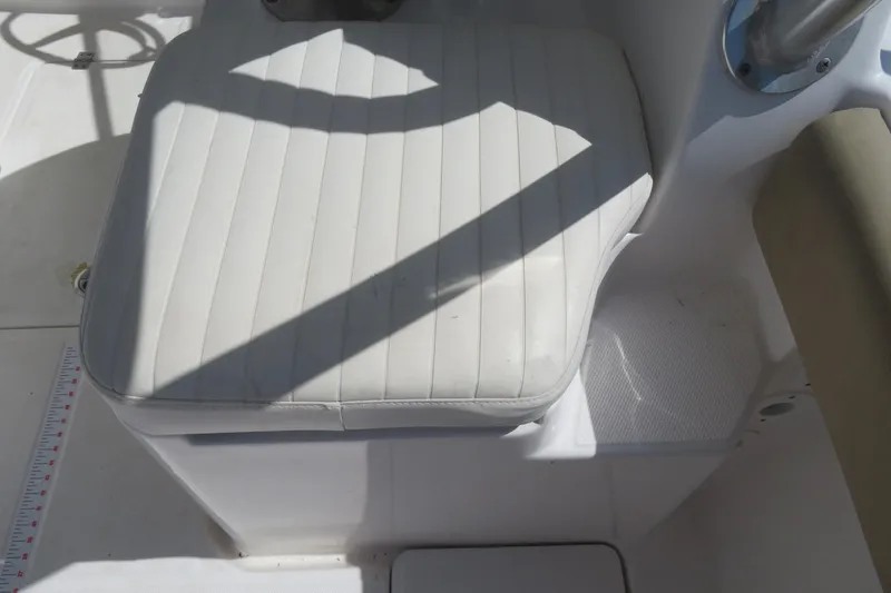 Slide: The Image of White cushioned seat on 2017 Sea Fox 256 Voyager boat deck. - 27