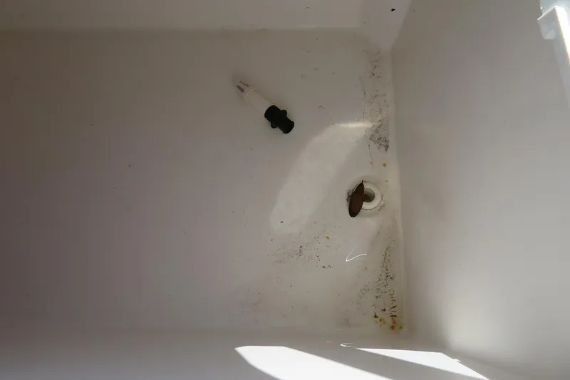 Slide: The Image of Interior of a 2017 Sea Fox 256 Voyager boat compartment with drain plug. - 29