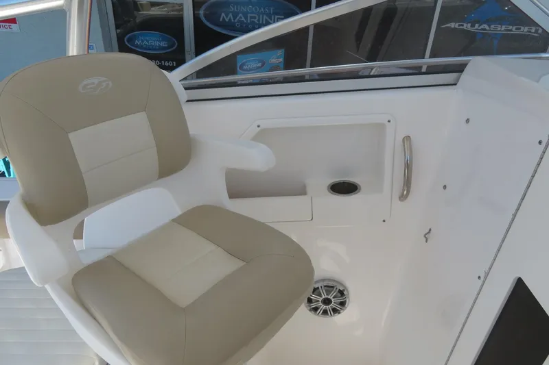 Slide: The Image of 2017 Sea Fox 256 Voyager boat interior with beige captain's chair and control panel. - 32