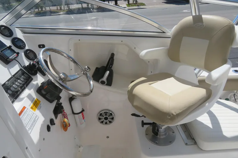 Slide: The Image of 2017 Sea Fox 256 Voyager helm with steering wheel and captain's chair. - 33