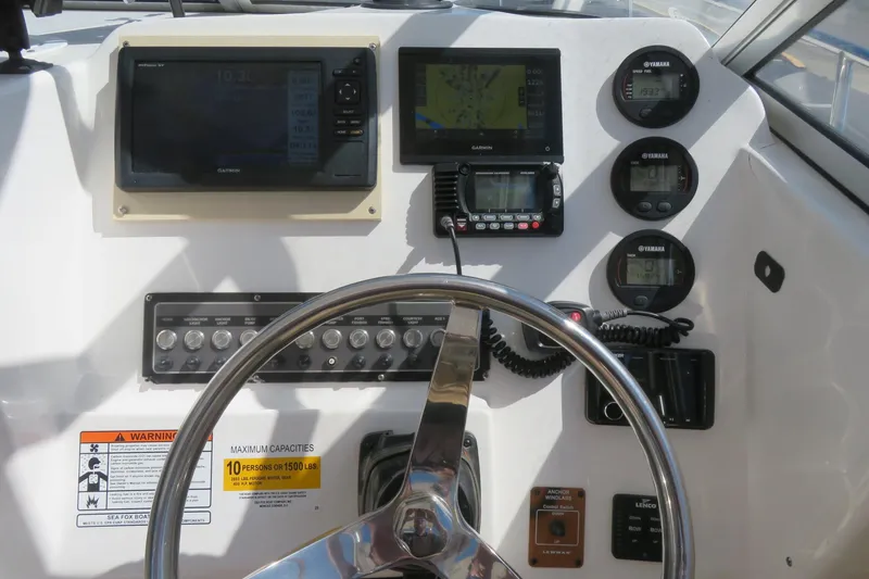 Slide: The Image of 2017 Sea Fox 256 Voyager dashboard with navigation and control instruments. - 34