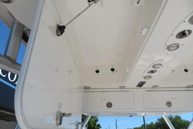 Slide: The Image of 2017 Sea Fox 256 Voyager boat interior ceiling with storage compartments and fixtures. - 49