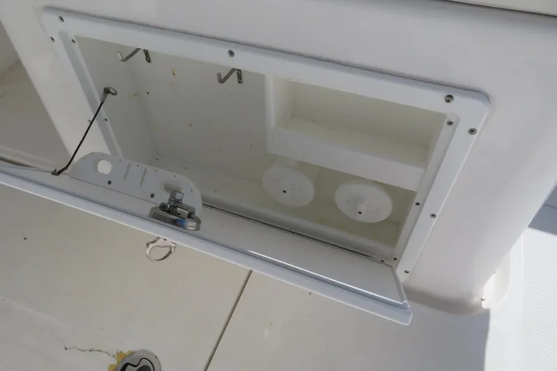 Slide: The Image of Open storage compartment on 2017 Sea Fox 256 Voyager boat. - 55