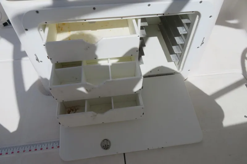 Slide: The Image of Storage compartments on a 2017 Sea Fox 256 Voyager boat, featuring multiple drawers. - 57