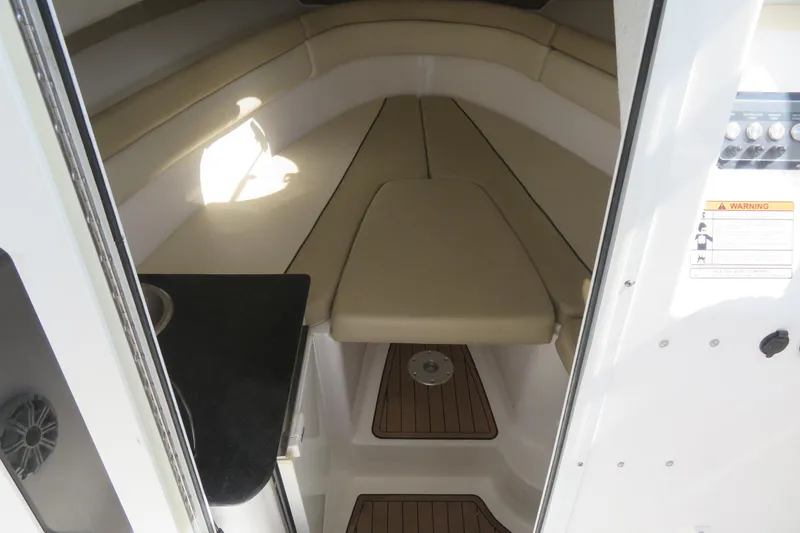 Slide: The Image of Interior cabin of 2017 Sea Fox 256 Voyager boat with beige seating and wood flooring. - 59