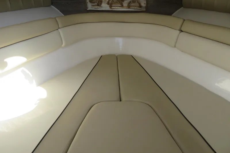 Slide: The Image of Interior seating of 2017 Sea Fox 256 Voyager boat, featuring beige cushioned upholstery. - 60
