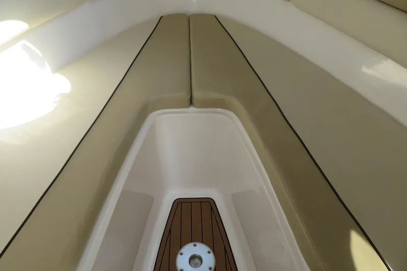 Slide: The Image of Interior view of 2017 Sea Fox 256 Voyager boat with tan seating and wood accents. - 61