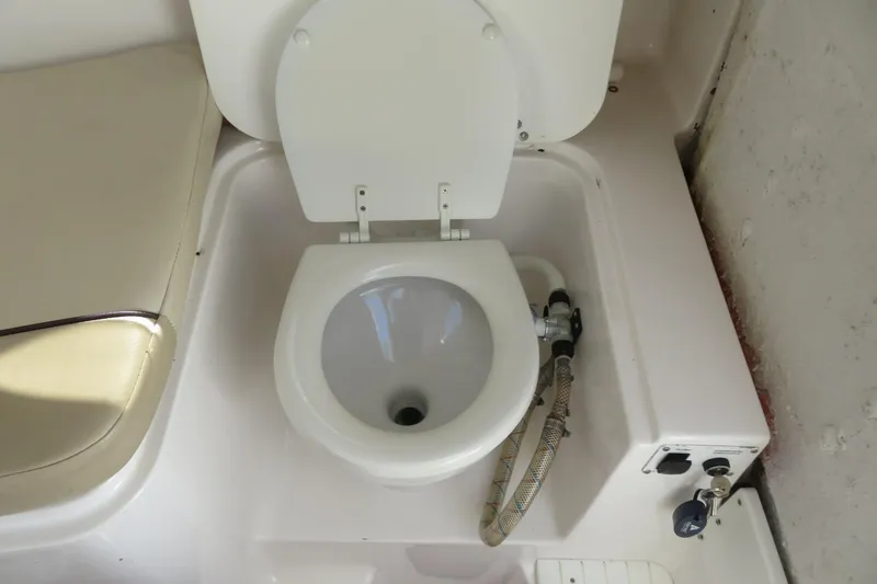 Slide: The Image of Boat toilet on 2017 Sea Fox 256 Voyager, featuring a compact marine design. - 64