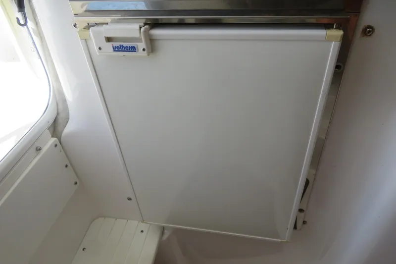 Slide: The Image of Built-in refrigerator on a 2017 Sea Fox 256 Voyager boat. - 68