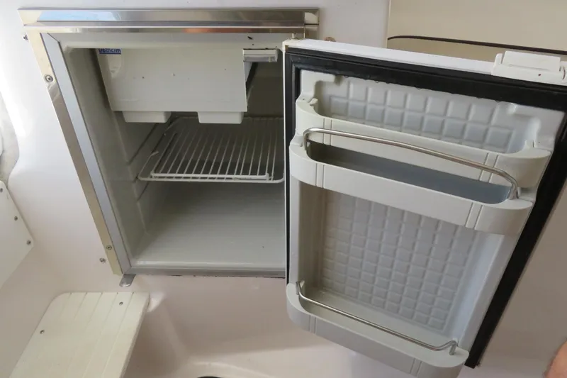 Slide: The Image of Open refrigerator inside a 2017 Sea Fox 256 Voyager boat. - 69
