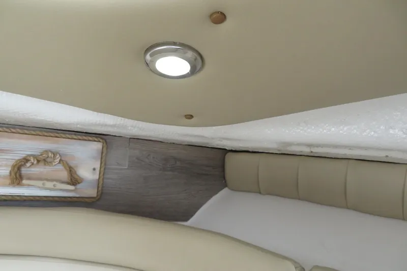 Slide: The Image of Interior of 2017 Sea Fox 256 Voyager boat with beige upholstery and ceiling light. - 73