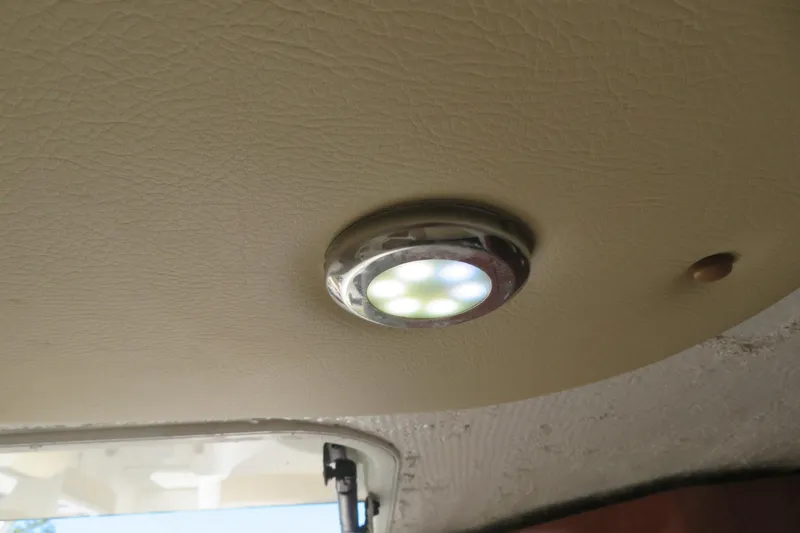 Slide: The Image of LED ceiling light inside a 2017 Sea Fox 256 Voyager boat cabin. - 74