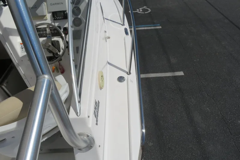 Slide: The Image of 2017 Sea Fox 256 Voyager boat deck with steering wheel and Garmin equipment. - 76
