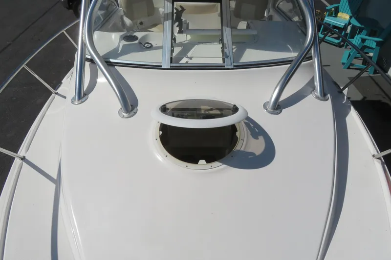Slide: The Image of 2017 Sea Fox 256 Voyager boat deck with open hatch and railing. - 77