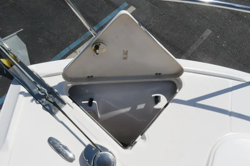 Slide: The Image of Open anchor hatch on 2017 Sea Fox 256 Voyager boat, showcasing storage compartment. - 81