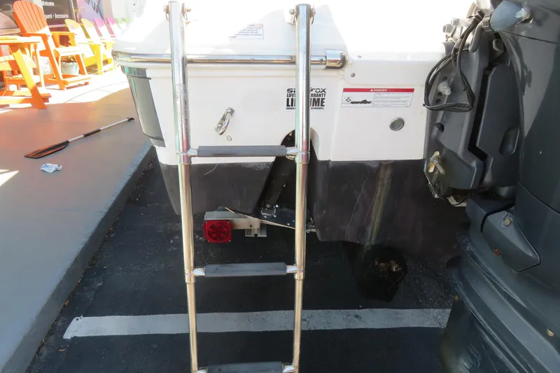Slide: The Image of Rear view of 2017 Sea Fox 256 Voyager boat with ladder and motor. - 88