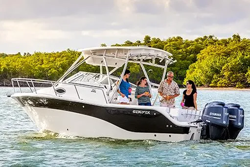Slide: The Image of Manufacturer Provided Image: 2017 Sea Fox 256 Voyager boat cruising with passengers on a sunny day. - 92