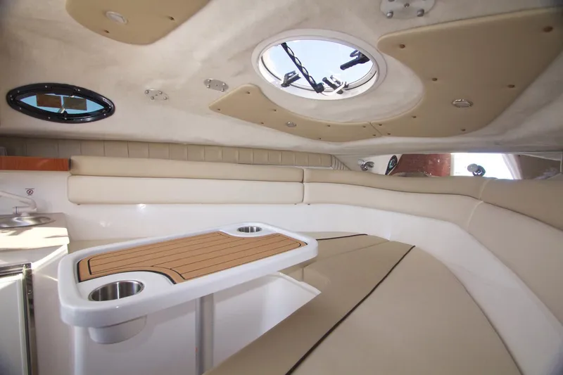 Slide: The Image of Manufacturer Provided Image: Interior cabin of 2017 Sea Fox 256 Voyager with beige seating and table. - 96