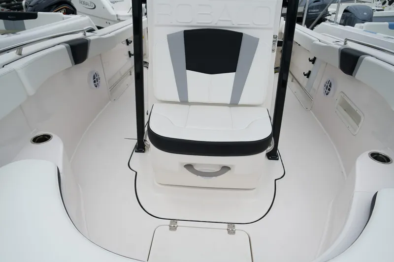 Slide: The Image of 2025 Robalo R222 Center Console boat interior with cushioned seating and sleek design. - 13