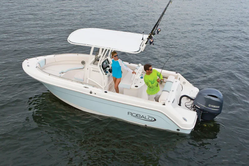 Slide: The Image of Manufacturer Provided Image: 2025 Robalo R222 Center Console boat on water with two people fishing. - 18