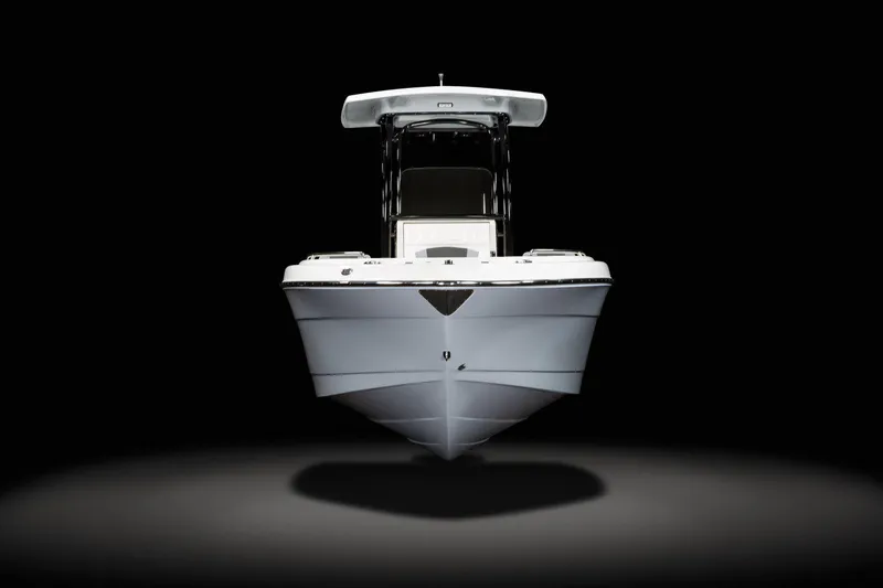 Slide: The Image of Manufacturer Provided Image: 2025 Robalo R222 Center Console boat, front view, sleek design, black background. - 20