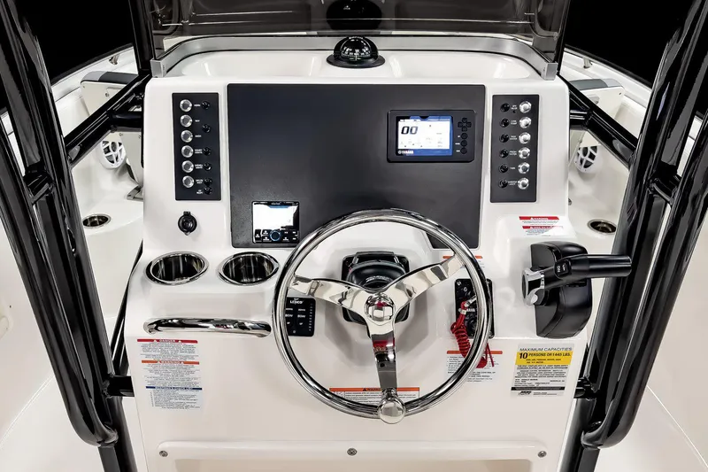 Slide: The Image of Manufacturer Provided Image: 2025 Robalo R222 Center Console dashboard with steering wheel and electronic controls. - 23