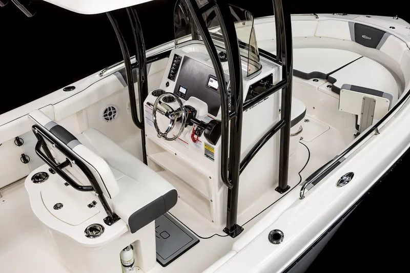 Slide: The Image of Manufacturer Provided Image: 2025 Robalo R222 Center Console boat interior with sleek design and modern controls. - 24