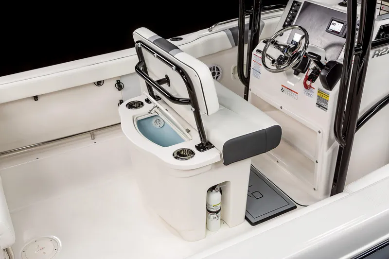 Slide: The Image of Manufacturer Provided Image: 2025 Robalo R222 Center Console boat interior with steering wheel and seating area. - 25