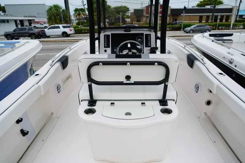 Slide: The Image of 2025 Robalo R222 Center Console boat interior with steering wheel and seating area. - 5