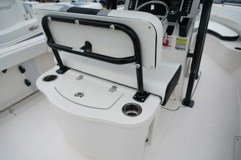 Slide: The Image of 2025 Robalo R222 Center Console boat interior with seating and console details. - 6
