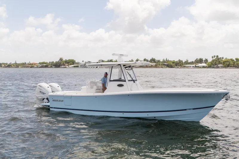 The Image of 2026 Regulator 31 boat cruising on a sunny day with twin engines. - 0