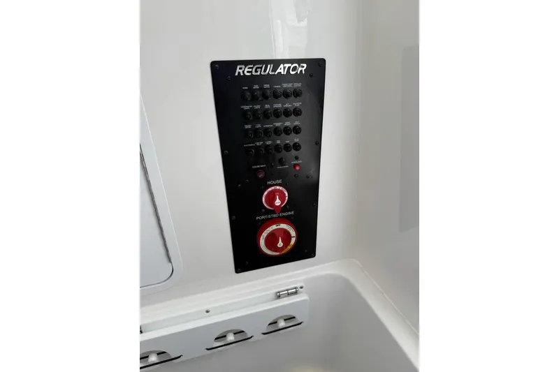Slide: The Image of Control panel of 2026 Regulator 31 boat with switches and dials. - 21