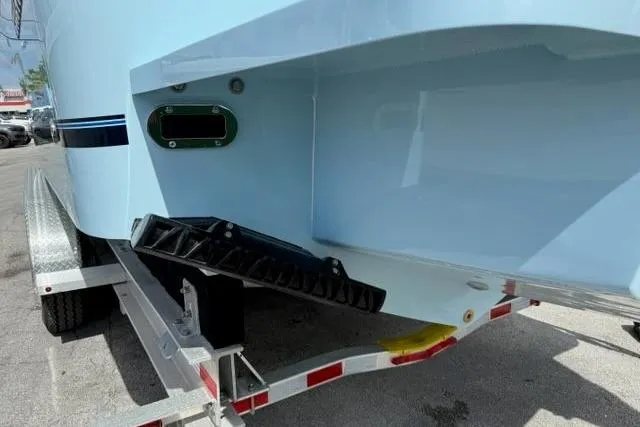 Slide: The Image of 2026 Regulator 31 boat on trailer, showcasing hull and trim details. - 24