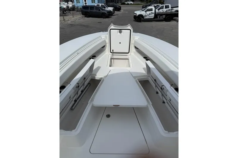 Slide: The Image of 2026 Regulator 31 boat interior with open storage compartments and seating area. - 26